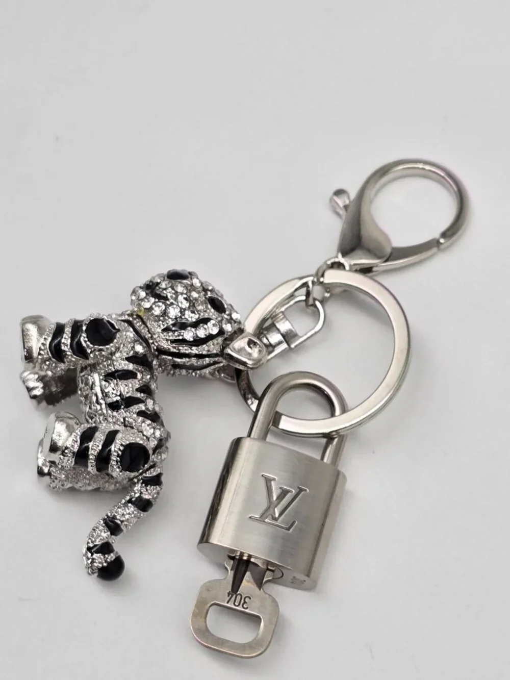 Authentic Louis Vuitton Silver Padlock with Unbranded Silver Tiger Bagcharm